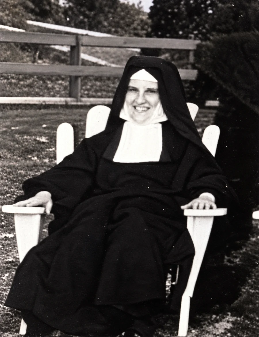 Sister Mary Elaine smiling while seated outdoors